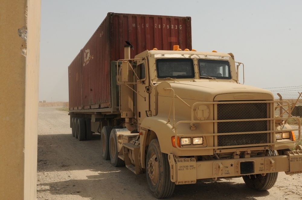 Soldiers track trailers at transfer point