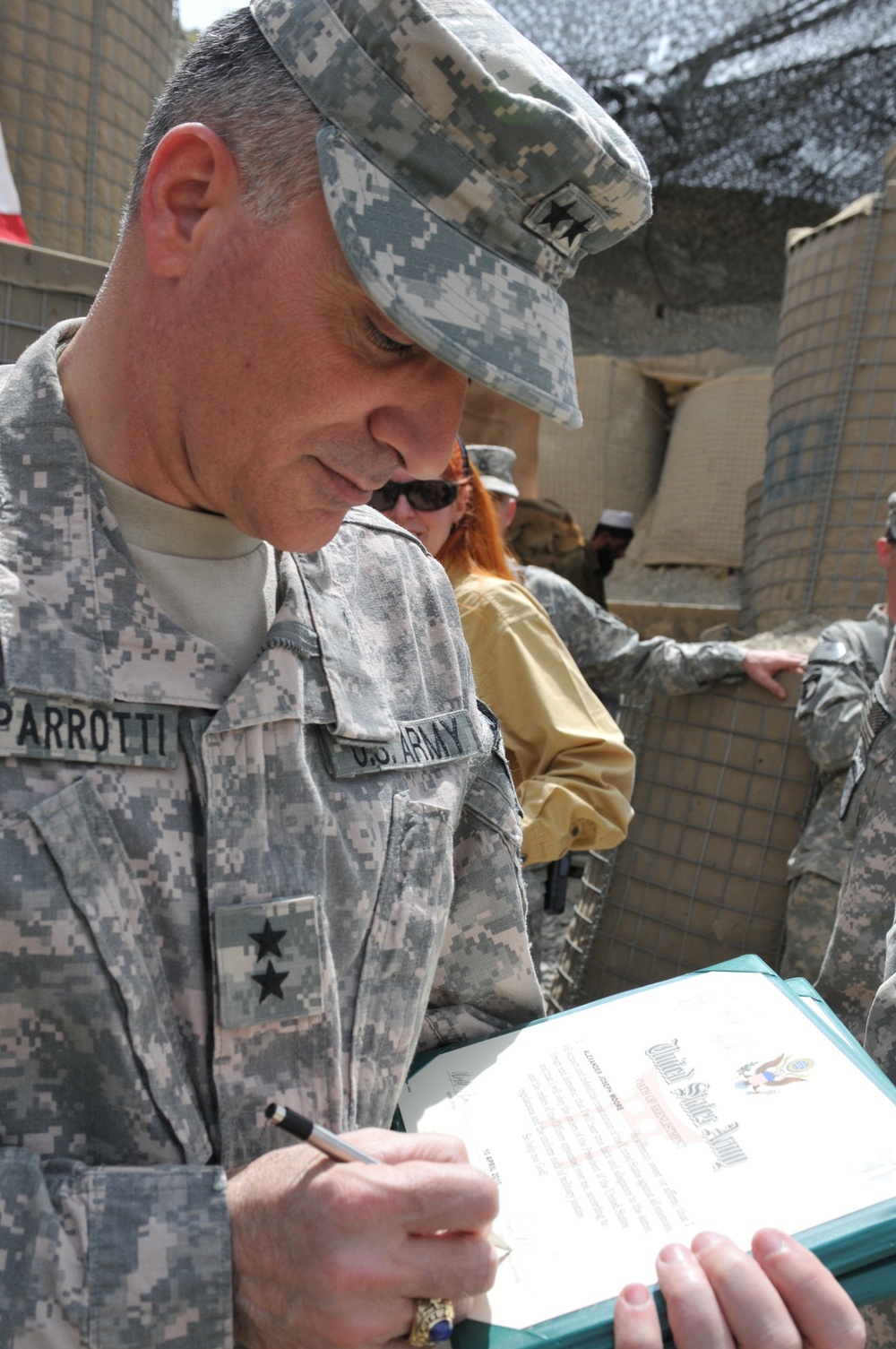 Four stars and two parents make for a special re-enlistment ceremony in Afghanistan