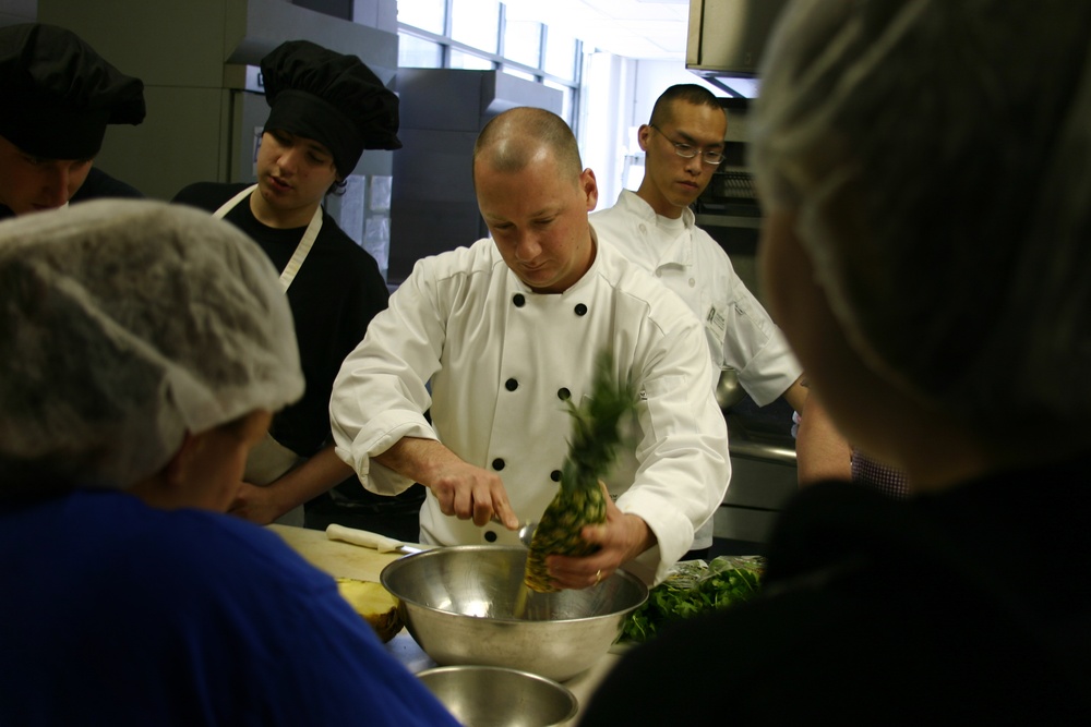 Navy Counselor cooks with students