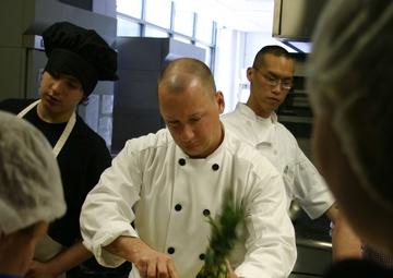 Navy Counselor cooks with students