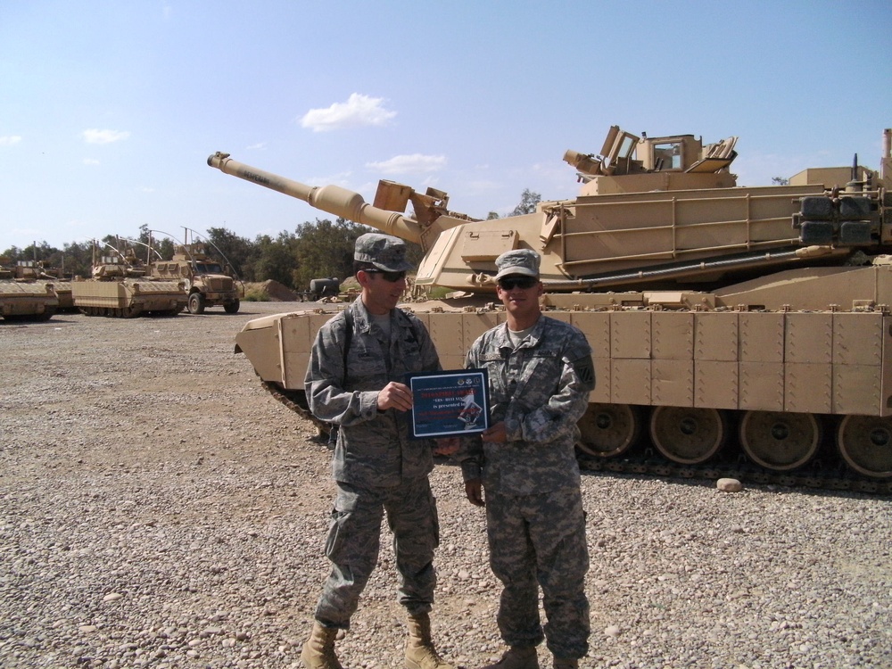 Air Force colonel re-enlists Airmen on Army tank