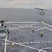 an AH-1 Cobra helicopter lands aboard USS New York