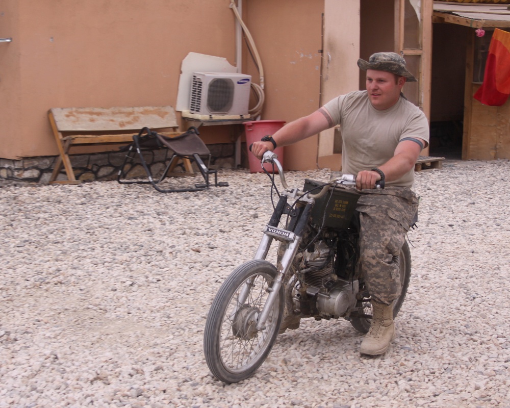 Spc. Fixes Bike in Ghazni
