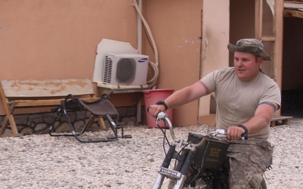 Spc. Fixes Bike in Ghazni