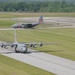 Aircraft From the North Carolina Air National Guard MAFFS Seven Taxies Onto the Runway to Take-off to Perform Another MAFFS Training Mission, While MAFFS Eight Taxies in for Another Round of Servicing and Reloading Before Returning to the Sky in Greenvill