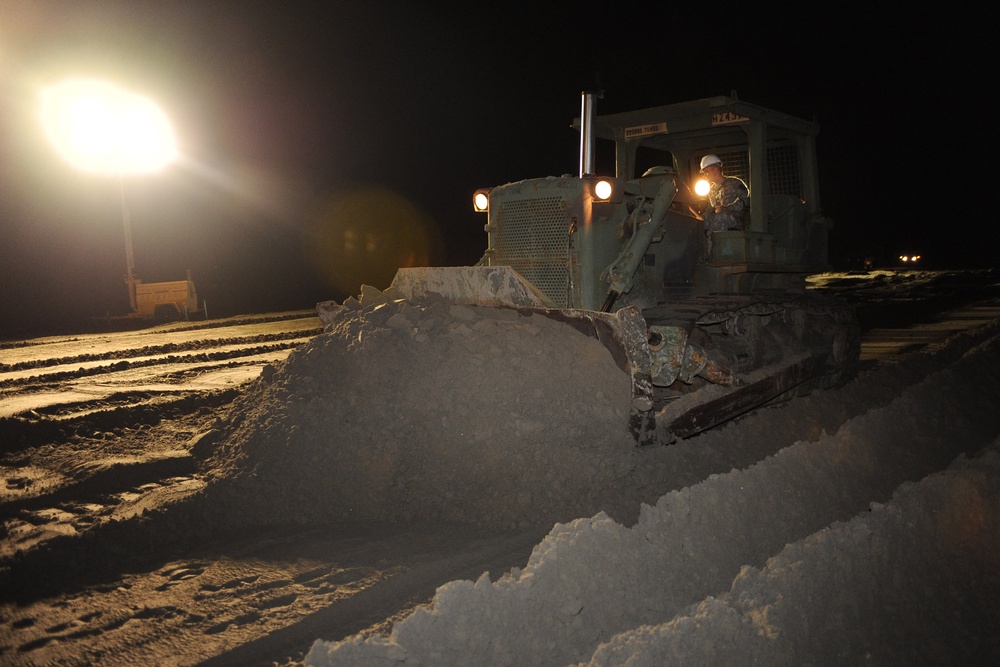Louisiana National Guard's Work Around the Clock Bulldozing Sand to Close a Strait Between Two Peninsulas in Grand Isle