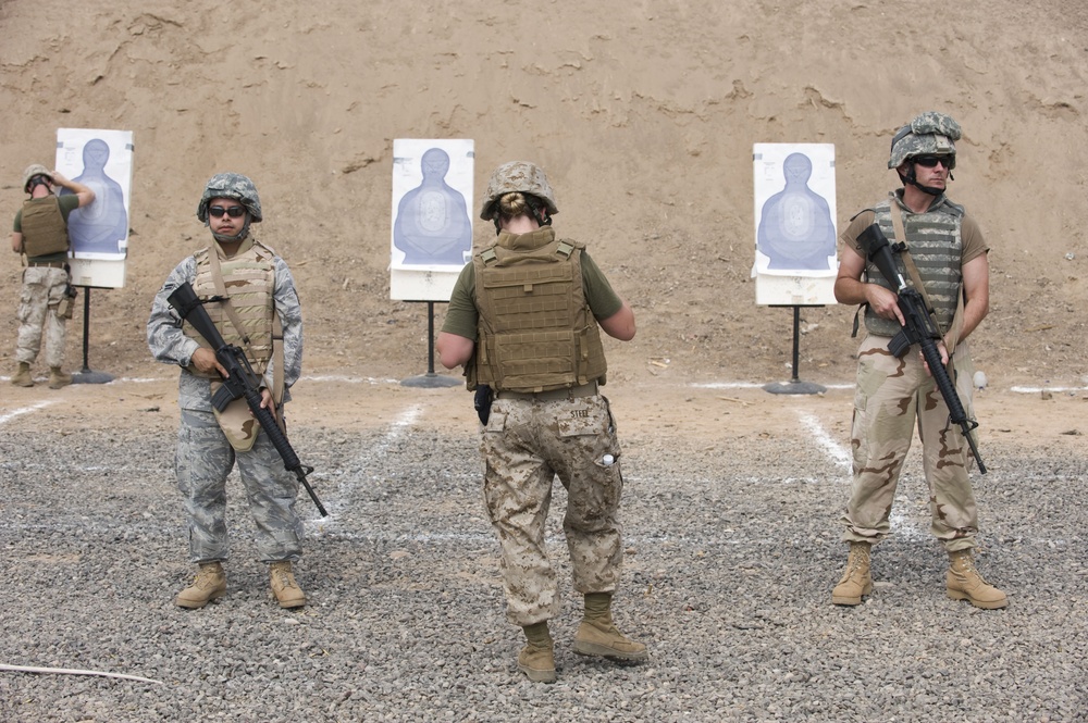 Service members fire weapons