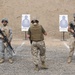 Service members fire weapons