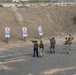 Service members fire weapons