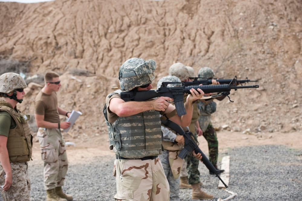 Service members fire weapons