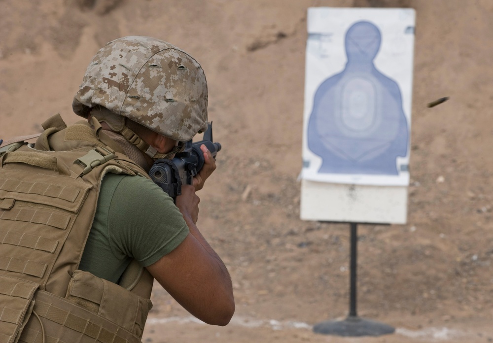 Service members fire weapons