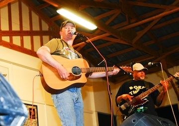 Country music singer performs double duty