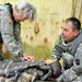 Sfc. Glenn Baker Performs First Aide on a Dummy Casualty During HEAT Training.