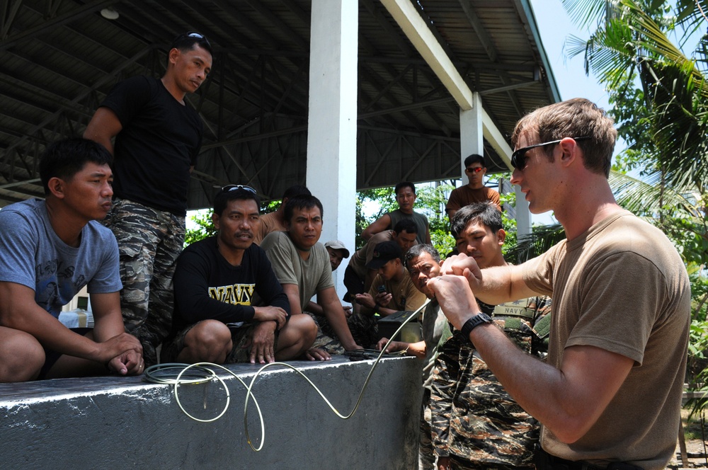 Philippine Army and Navy Explosive Techs dispose of hazardous material