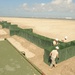 Guardsmen construct Hesco wall in Port Fourchon