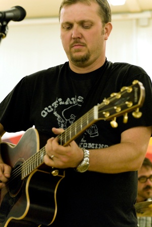 SPC Rory Garcia Plays Original Songs For Troops