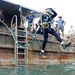 Sailors Dive for Remnants
