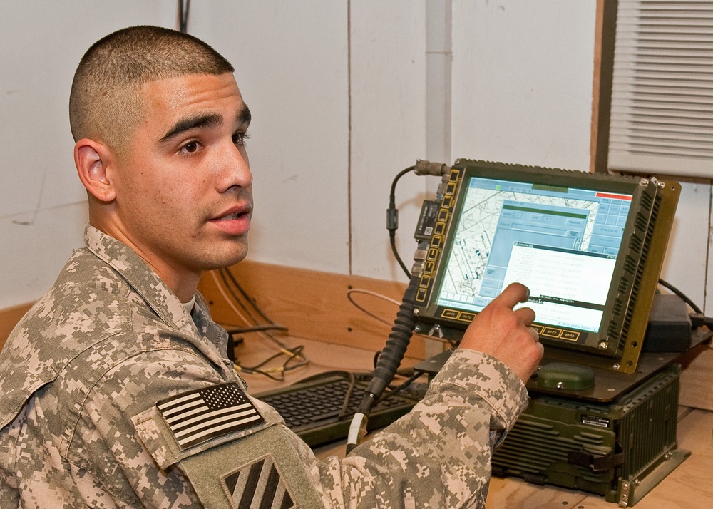 Soldiers in communications and electronic building run the show