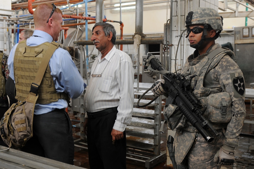 MPs escort aid workers to Iraqi agricultural college