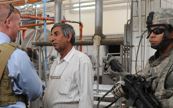 MPs escort aid workers to Iraqi agricultural college