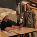 Michael Peterson Meets and Signs Autographs for U.S. Soldiers