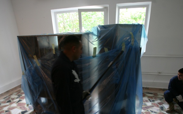 Marines, Sailors volunteer to improve home for HIV-positive Romanian teens