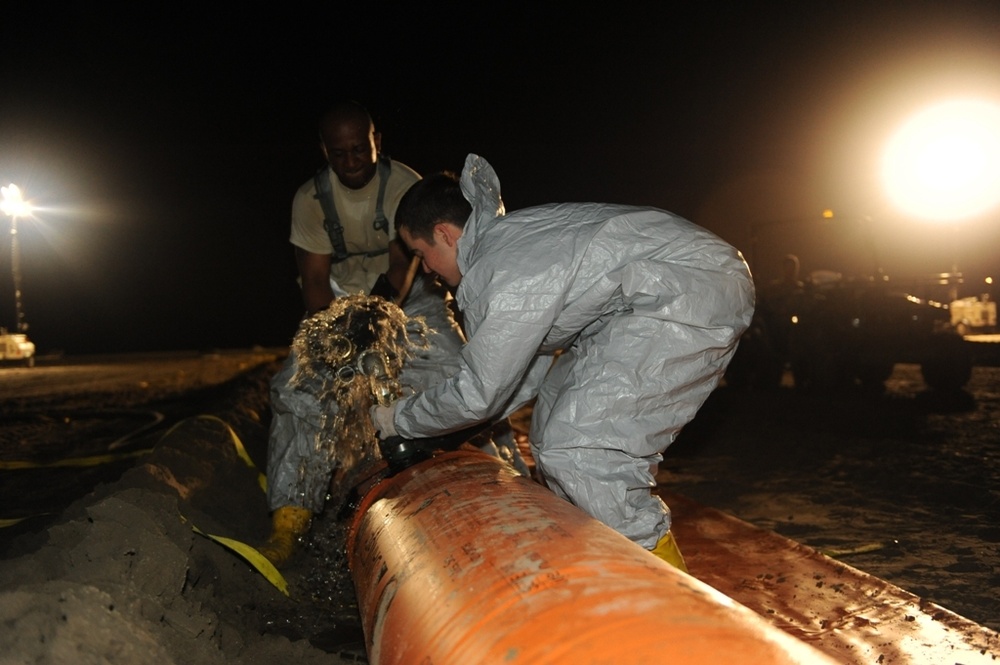 Louisiana National Guardsmen defend the shoreline around the clock
