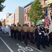 Coast Guard Sector New York, Staten Island color guard members lead Marines and Sailors through a downtown section of Greenpoint, Brooklyn, during the 10th annual Greenpoint Veterans Day parade. Approximately 3,000 Sailors, Marines and Coast Guardsmen are