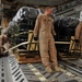 Airman Inspects Delivery Bundles