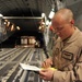 Airman Inspects Delivery Bundles
