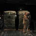 Airman Inspects Delivery Bundles
