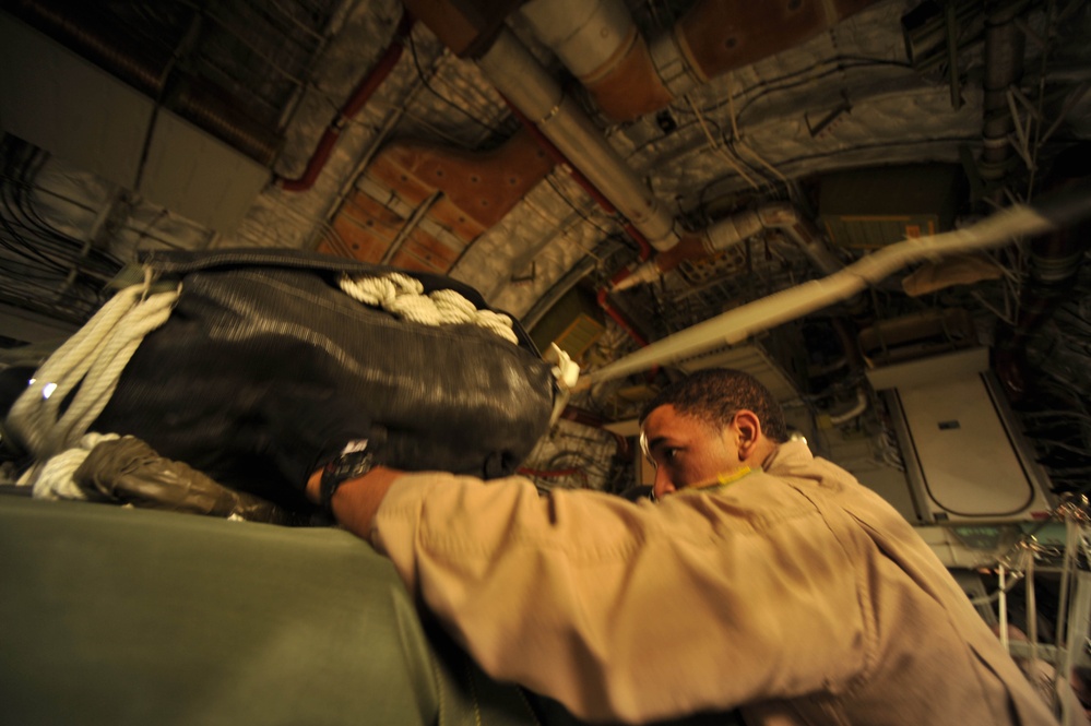 Airman Inspects Delivery Bundles