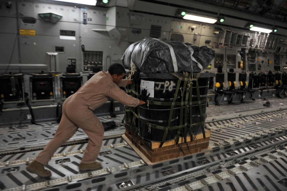 Airman Inspects Delivery Bundles