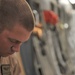 Airman Inspects Delivery Bundles