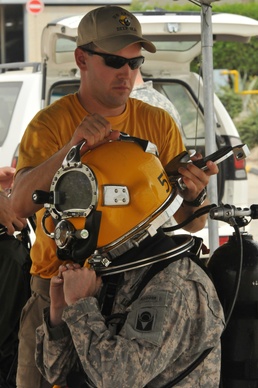 Dive Team: The 511th Dive team promotes their commander underwater and invites other service members to have a short diving experience