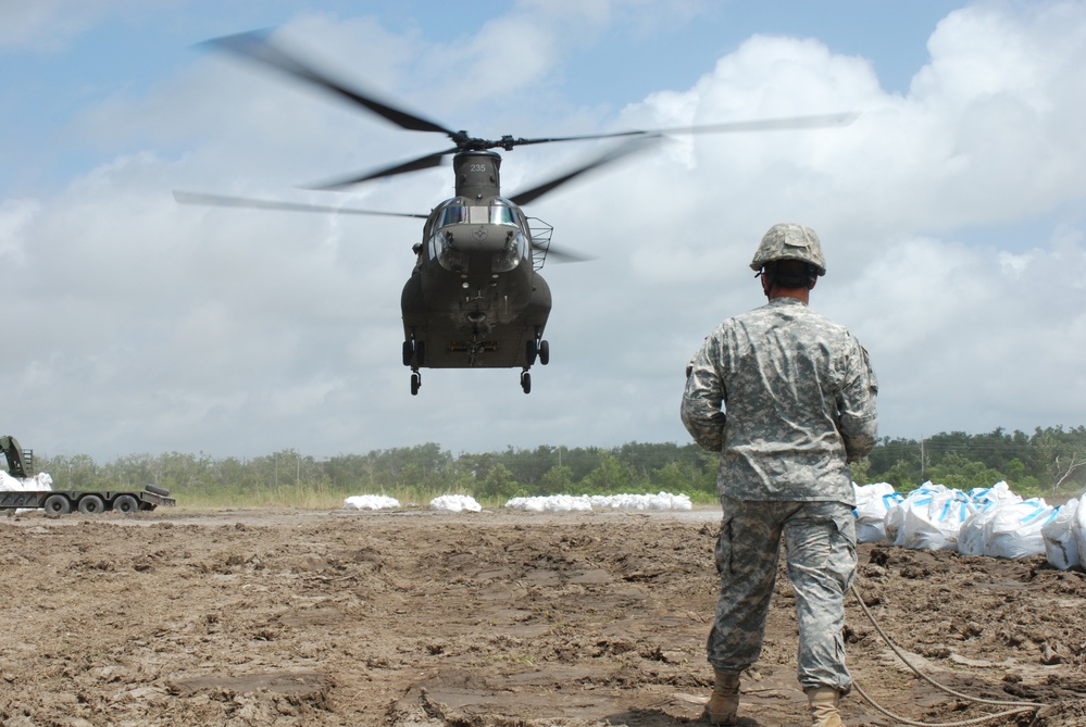 Louisiana National Guardsmen receive assistance with shoreline protection