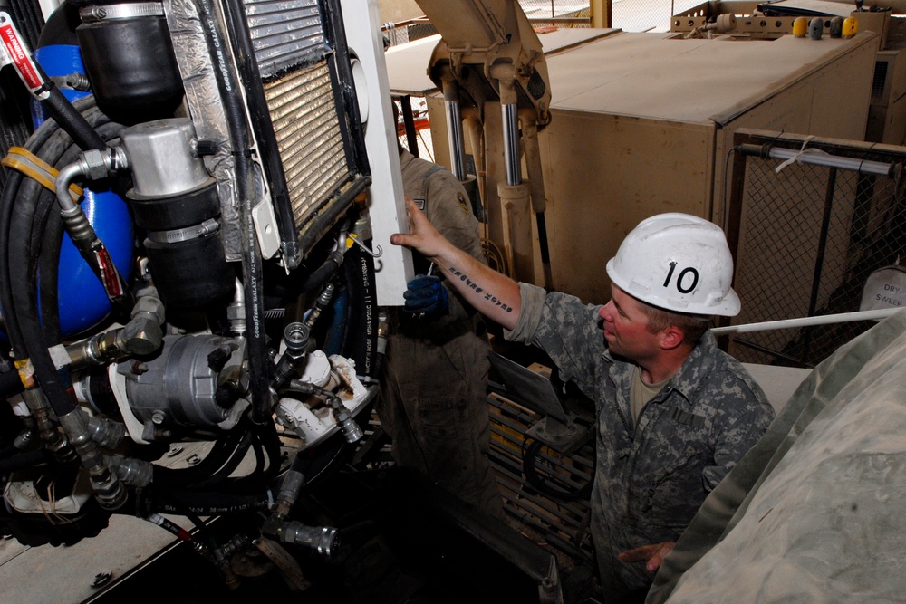 CRT mechanics, Stryker operators work together to keep vehicles rolling