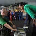 Sailors maintain aircraft aboard USS Dwight D. Eisenhower