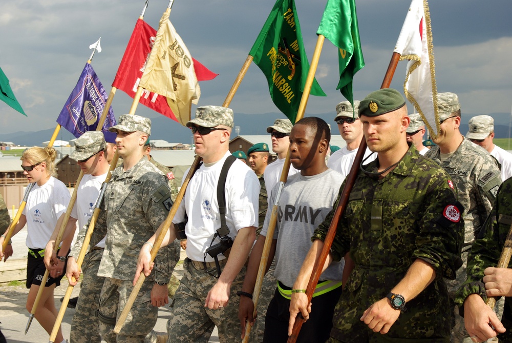 NATO forces march in Kosovo, Iraq and Afghanistan in memory of fallen