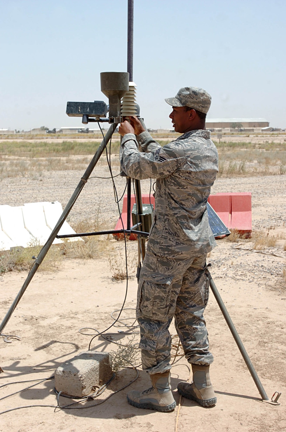 Air Force Master Sgt. Paul Rogers, weather forecaster and staff weather team non-commissioned officer-in-charge, 22nd Expeditionary Weather Squadron, supporting TF Wings, teaches Soldiers how to perform certain field weather checks and observations during