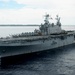 USS Peleliu passes its namesake island, renders honors