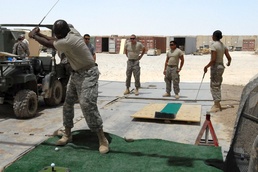 Soldiers play golf at Contingency Operating Station Hammer