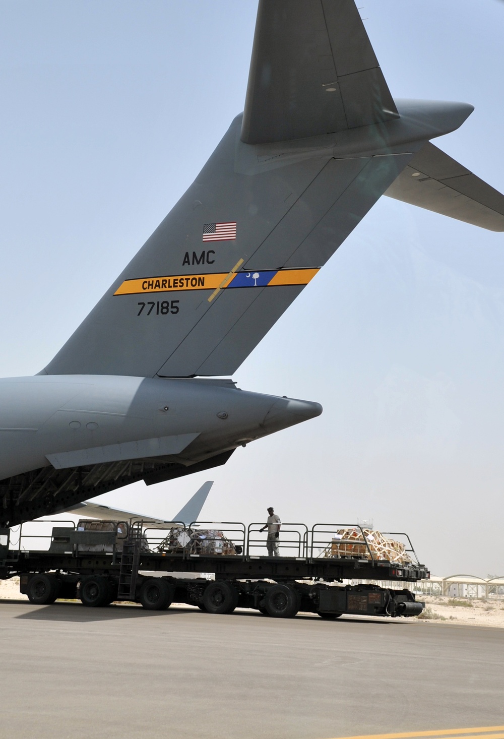 Air Transportation Airmen From the 380th Expeditionary Logistics Readiness Squadron's Air Terminal Operations Center Drives a 60,000-pound-capable Aircraft Loader to Unload a Plane During Operations for the 380th Air Expeditionary Wing at a Non-disclosed