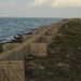 Louisiana National Guardsmen construct a Hesco Concertainer barrier wall along portions of the Cameron Parish coastline