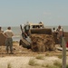 Louisiana National Guardsmen construct a Hesco Concertainer barrier wall along portions of the Cameron Parish coastline