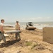 Louisiana National Guardsmen construct a Hesco Concertainer barrier wall along portions of the Cameron Parish coastline