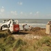 Louisiana National Guardsmen construct a Hesco Concertainer barrier wall along portions of the Cameron Parish coastline