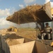 Louisiana National Guardsmen construct a Hesco Concertainer barrier wall along portions of the Cameron Parish coastline