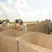 Louisiana National Guardsmen construct a Hesco Concertainer barrier wall along portions of the Cameron Parish coastline