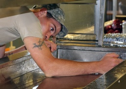 Army Food Service Workers Serve Soldiers